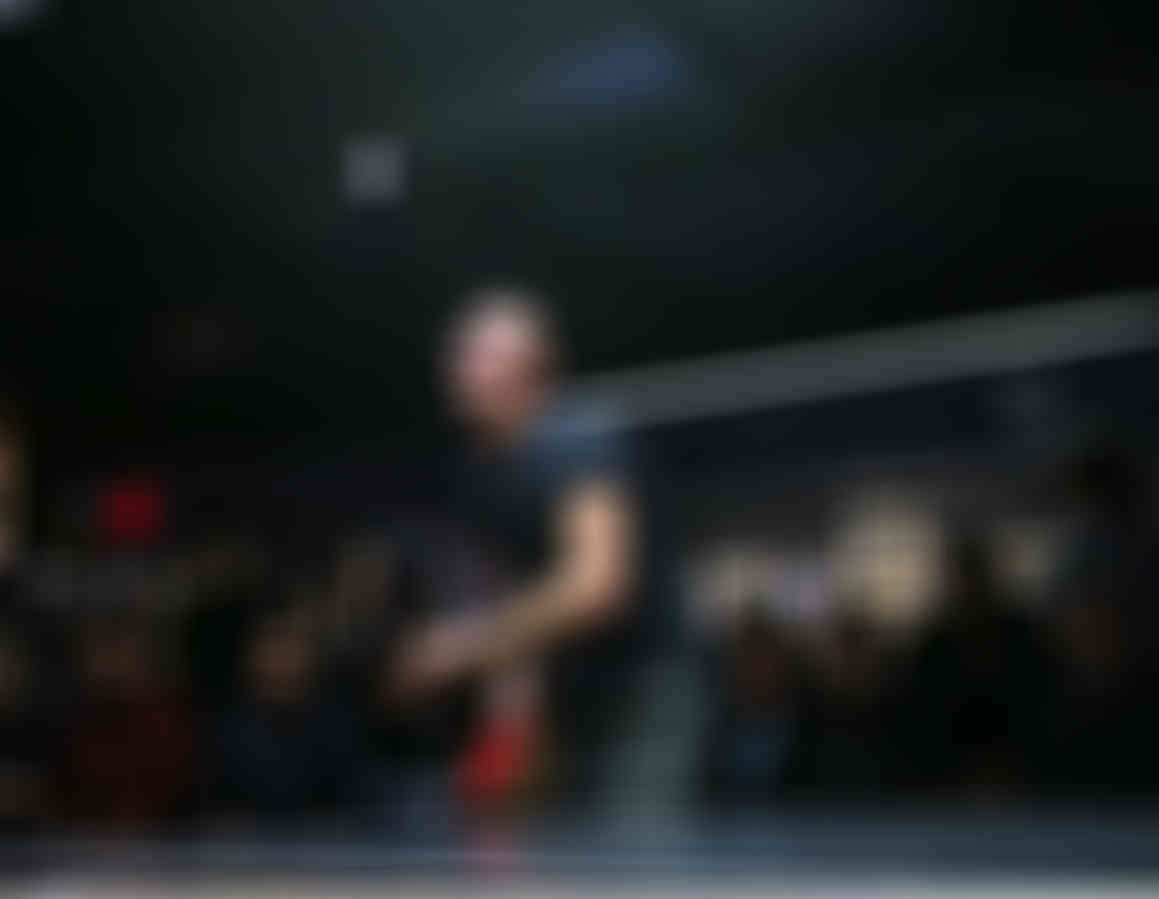 Blurred image of a man performing on stage