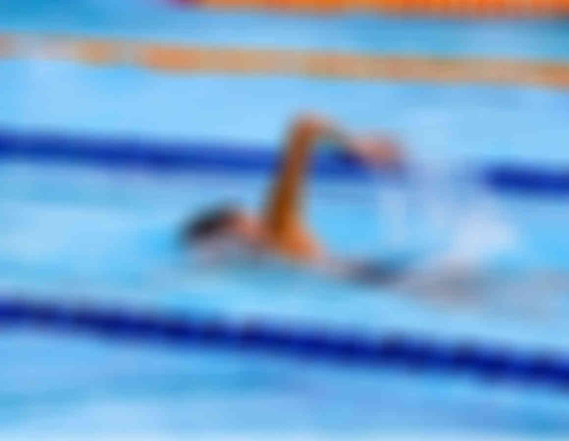 Blurred image of boy swimming