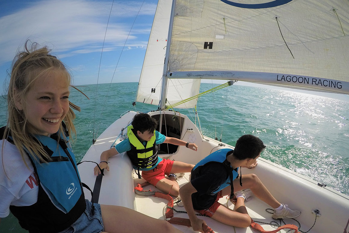 Three Bucksmore students sailing a boat