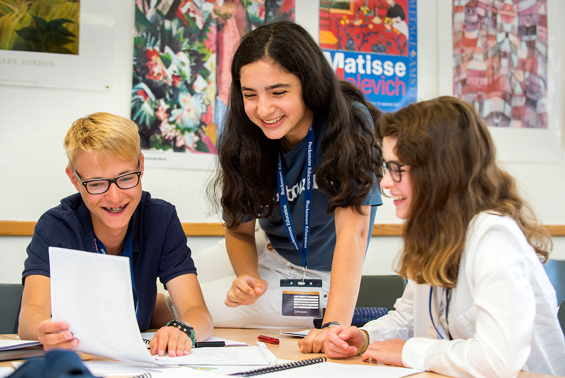 Bucksmore students around table at Tonbridge School