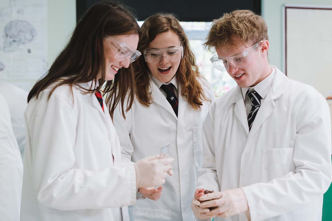Stamford High School students in lab coats