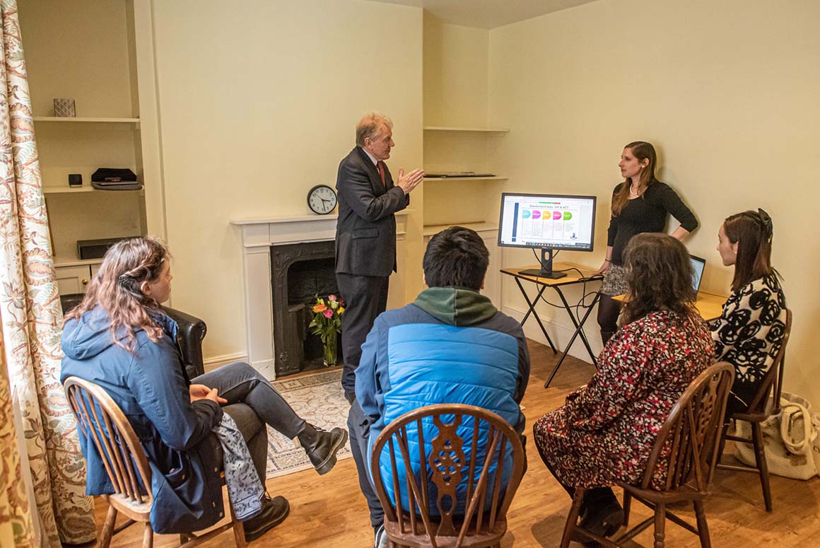 Greene's College Oxford student presenting to tutor and other students