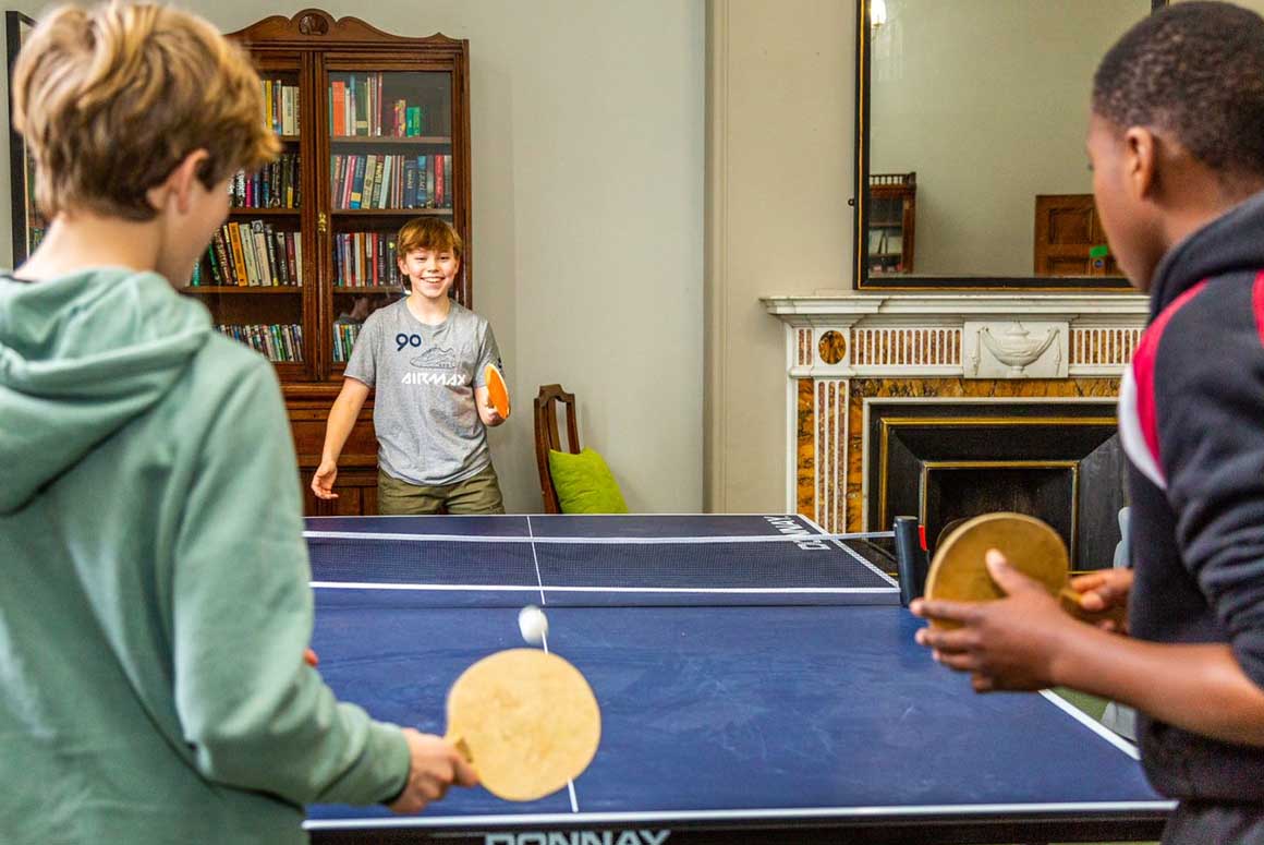 Westonbirt Boarding School students playing table tennis in the common room